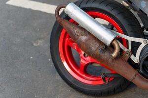 motorcycle with a rusty exhaust pipe photo