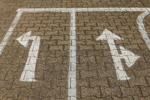 parking lot with two arrows pointing in opposite directions photo