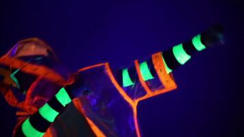 Man is dancing in neon clothes close up video