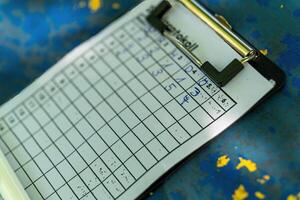 clipboard with a bunch of numbers on it photo