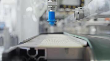 Metal sheet is drawn up by a suction cup, which elevates it and transports it to a different location on a sophisticated machine in a state-of-the-art factory. video