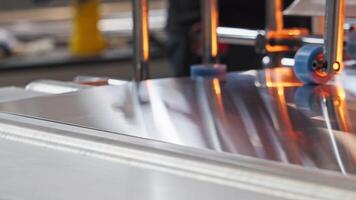 close-up view of the process of metal sheet movement along the assembly line in a workshop dedicated to furniture production. video