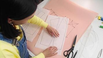 Designer uses a pattern to create a stunning designer vest. video