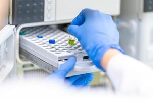 examination of a chemical sample using modern devices in the biochemical laboratory of the research institute photo