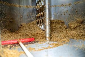 cleaning the boiler from residual malt after brewing beer in the brewery. top view photo
