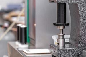 closed with the lid of beverage cans in an automatic capping machine in a brewery photo