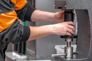 closed with the lid of beverage cans in an automatic capping machine in a brewery photo