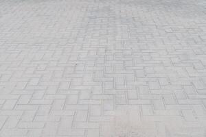 new sidewalk made of concrete interlocking paving blocks photo