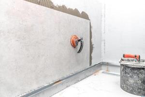 wall tiling with large-format ceramic tiles photo