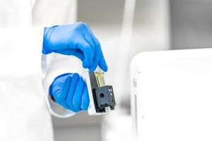 research in a biochemical laboratory using modern technologies. use a computer for scientific research photo