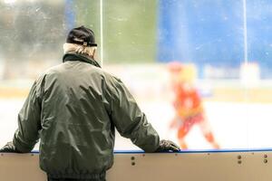a spectator at a game in a hockey stadium photo