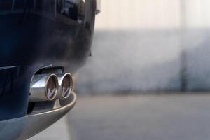 smoke from the exhaust of a car with a gasoline engine photo