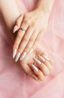 Female Hands with beautiful pearl manicure photo