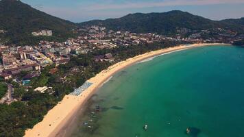 An aerial view of a beach with mountains in the background. View of Kata Beach, Phuket Island, Kingdom of Thailand video