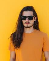 A confident model showcases a blank t-shirt against a bright yellow background photo