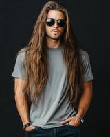 The model poses confidently with long hair, wearing a blank t-shirt photo