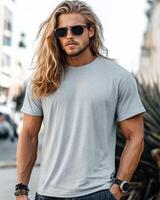 Handsome model showcases a blank t-shirt against a vibrant city backdrop photo
