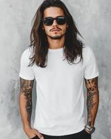 Handsome bad boy showcasing a blank shirt against a textured background photo