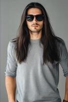 Model flaunts a long-haired, handsome style with blank clothing and sunglasses photo