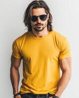 A handsome model poses confidently in a yellow blank t-shirt photo