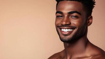 A handsome model showcases his beautiful smile against a soft backdrop photo