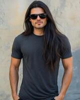 Model with long hair displays a simple t-shirt in an urban setting photo