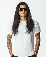 Handsome model with tattoos wears a blank t-shirt in a chic environment photo