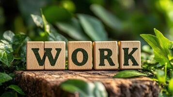 A wooden block with the word WORK written on it photo