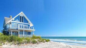A charming beach house nestled by the shore enjoys golden sunlight and gentle waves photo