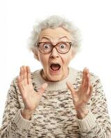 An older woman excitedly reacts with astonishment and joy photo