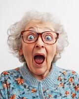 An older woman shows surprise and excitement with a joyful expression photo