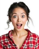 A woman with wide eyes and an open mouth shows excitement and surprise photo
