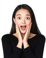 A woman beams with excitement, her hands resting on her cheeks in surprise photo