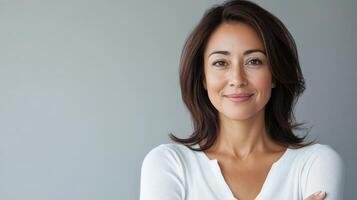 A warm smile and graceful presence light up the room photo