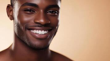 A handsome African male model beams with a charming smile against a soft backdrop photo