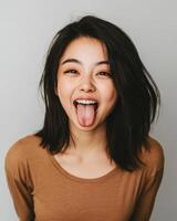 A cheerful girl shows her playful side in a cozy indoor environment photo