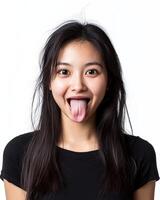 A young woman expresses delight with a playful tongue-out grin photo