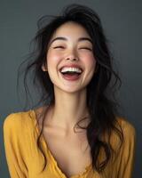 A radiant smile lights up the face of a young woman with tousled hair photo