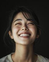 A young woman grins with genuine happiness, reflecting pure joy photo