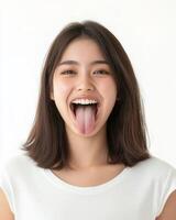A young woman is expressing joy with a playful tongue gesture photo