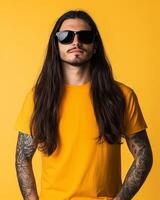 Model displays stylish long hair and tattoos while wearing a plain t-shirt photo