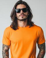 Model displays a striking orange t-shirt, exuding confidence and style photo
