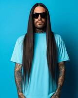 Model displays a trendy long-haired look in a vivid turquoise tee photo