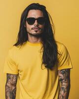 The model poses confidently in a bright yellow t-shirt and sunglasses photo