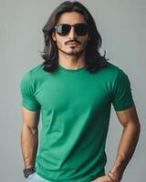 Confident model in a green t-shirt shows off his stylish look and attitude photo