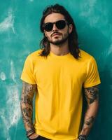 A stylish model poses confidently in a yellow t-shirt and sunglasses photo