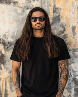 Handsome model poses confidently in a blank t-shirt with long flowing hair photo