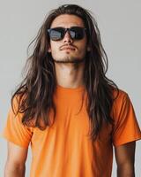 Model with long hair dons a blank t-shirt while striking a confident pose photo