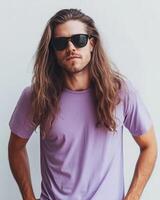 A stylish model poses confidently in a plain t-shirt with long hair photo