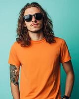A handsome model confidently poses in a vibrant t-shirt photo